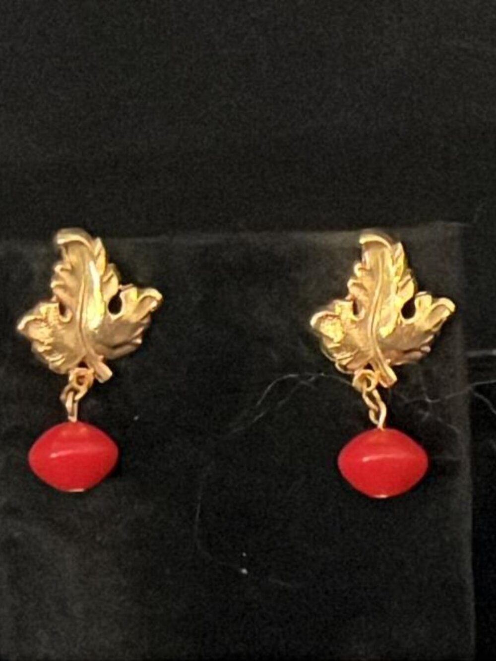 Red Bead Under Gold Tone Leaf Earrings